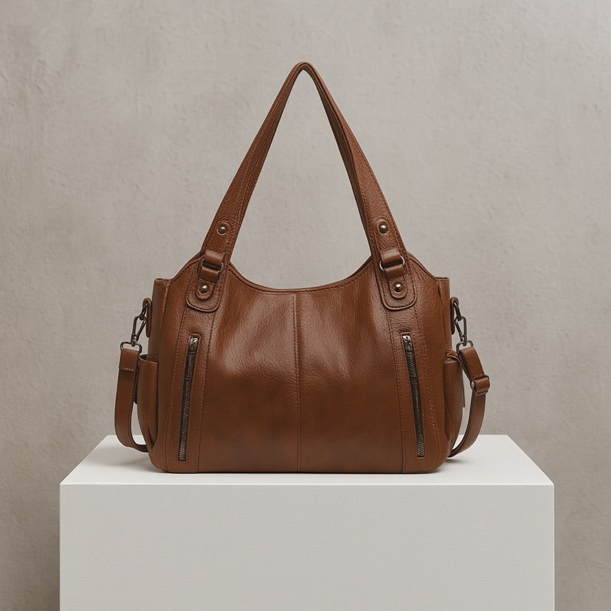 LORENA BARREL-TASCHE – SCHWARZE UMHÄNGETASCHE MIT DETAILS & VIEL PLATZ