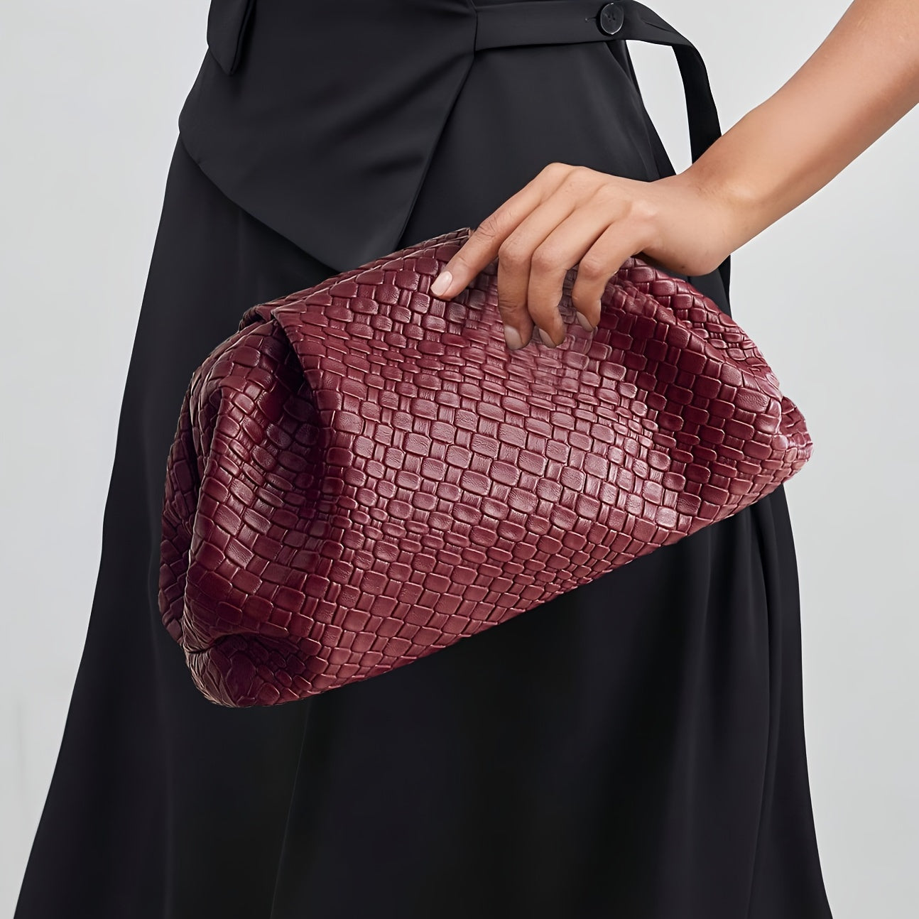 LORENA – GEFLOCHTENE CLUTCH AUS KUNSTLEDER