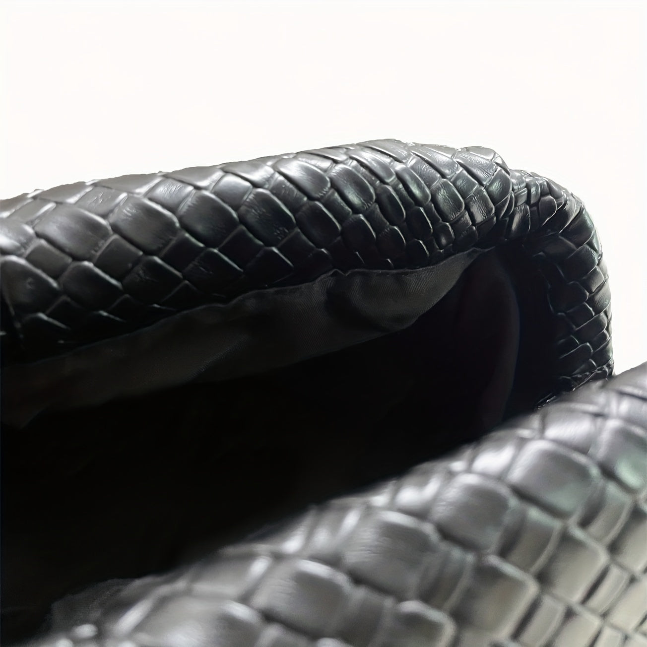 LORENA – GEFLOCHTENE CLUTCH AUS KUNSTLEDER