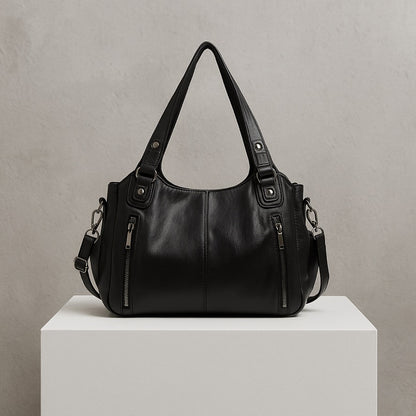 LORENA BARREL-TASCHE – SCHWARZE UMHÄNGETASCHE MIT DETAILS & VIEL PLATZ